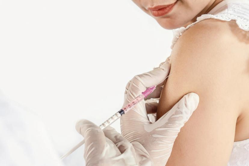 Depo-Provera birth control shot in arm, illustrating alleged link to meningioma brain tumors